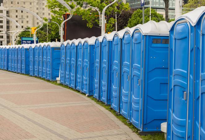 portable restrooms with sink and hand sanitizer stations, available at a festival in Atlanta